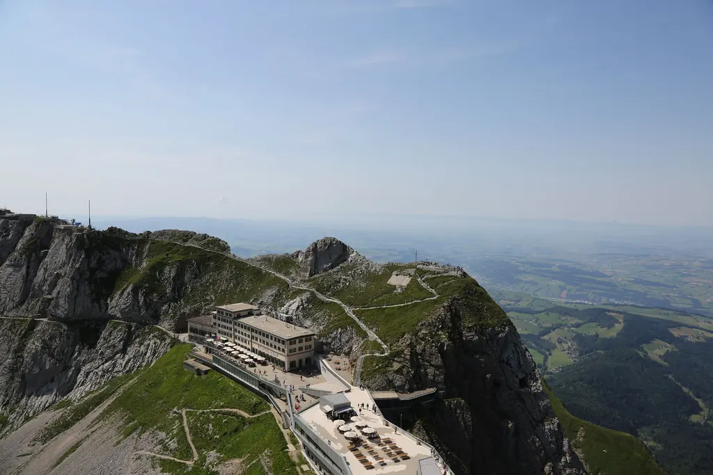 The Pilatus Kulm top station with its hotels on the ridge, the Oberhaupt peak and the sky behind